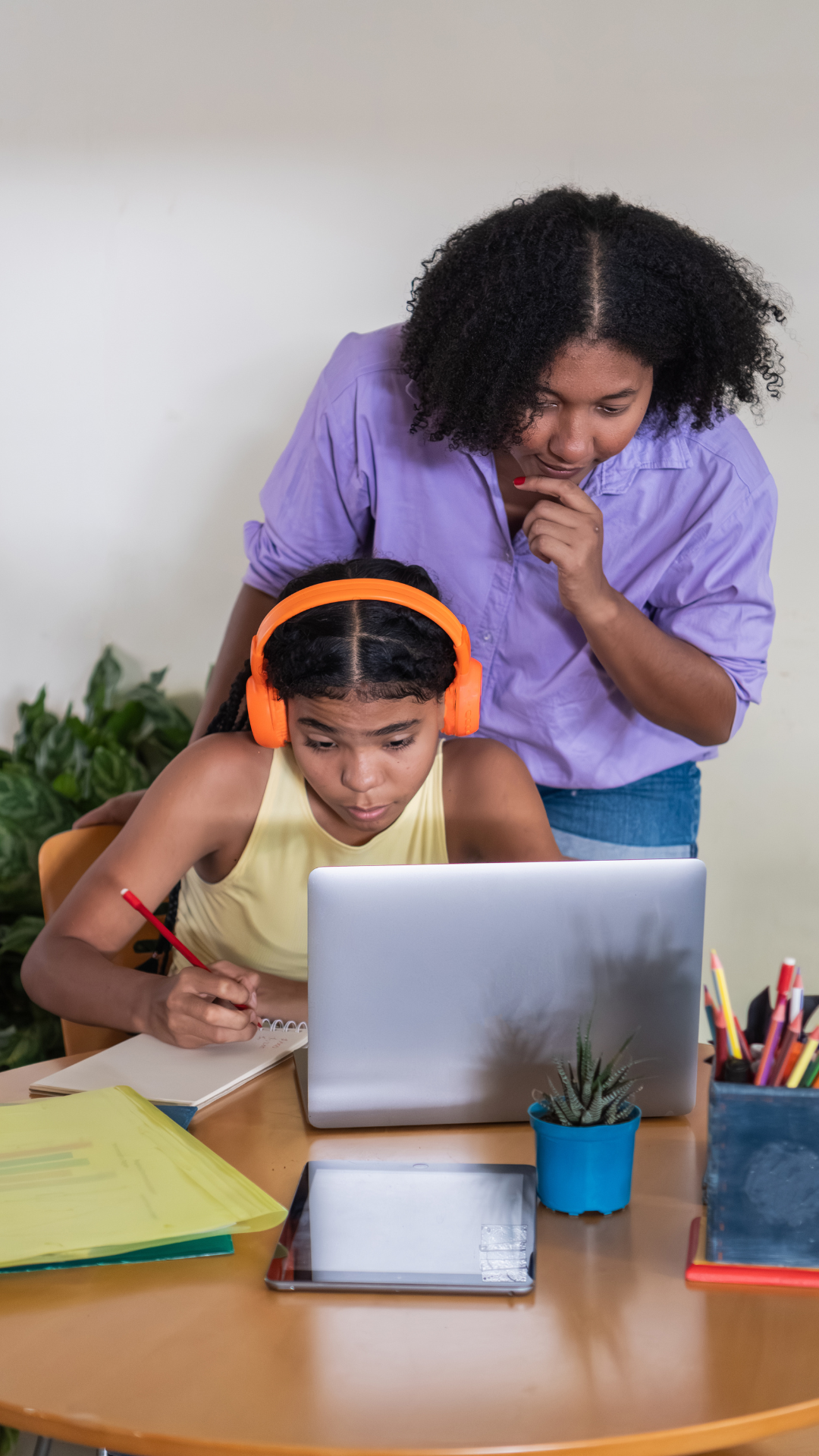 Student receiving individualized online special education support with adult guidance at Falcon View Online in Minnesota.