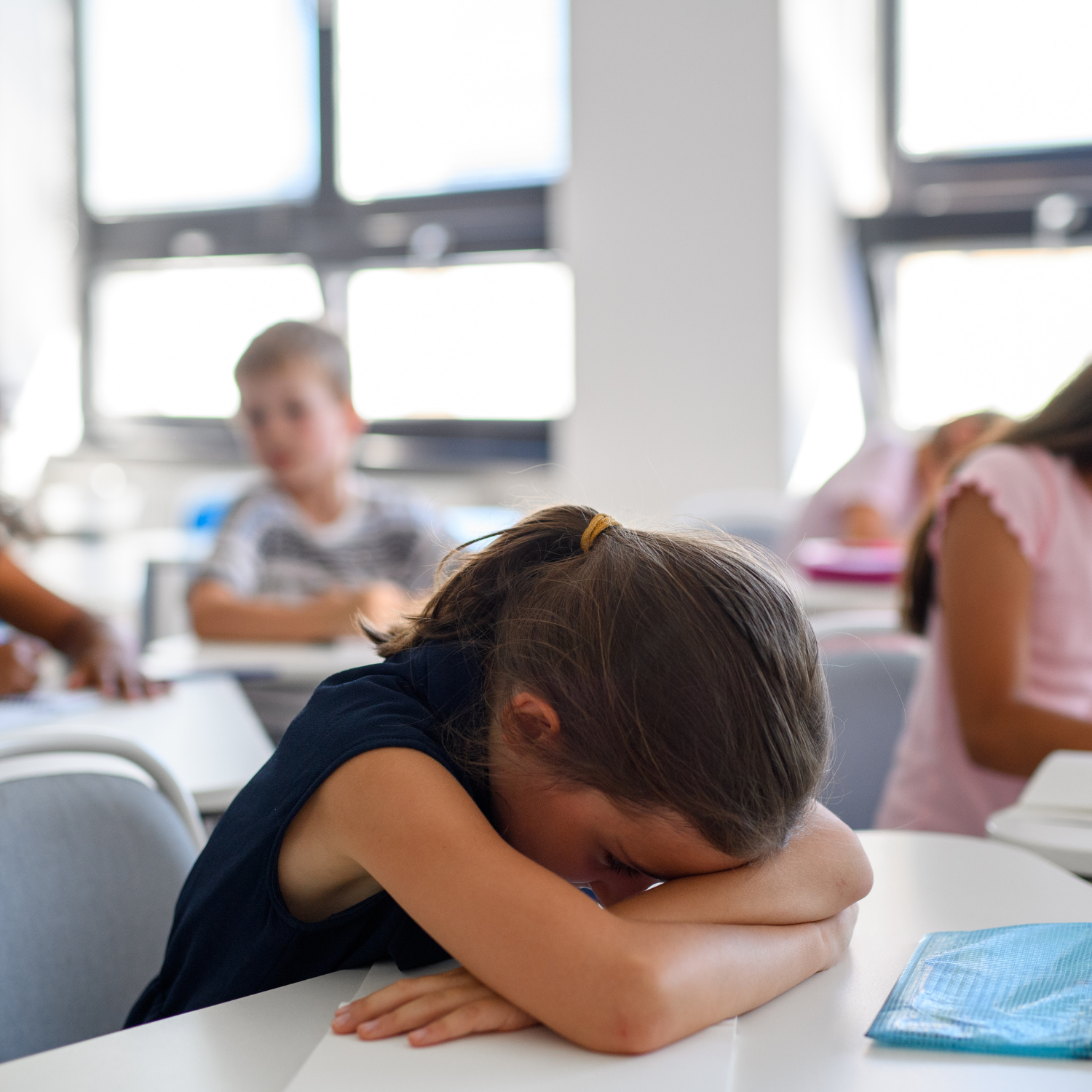 Student struggling in a traditional classroom, highlighting the need for alternative education options at Falcon View Online in Minnesota.