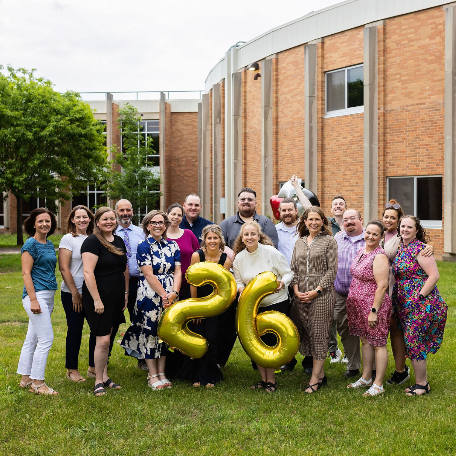 Falcon View Online teachers and staff gathered together outside Wabasha-Kellogg Schools, representing personalized student support and community in Minnesota.